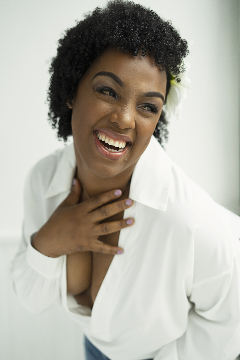 A woman with white shirt laughing
